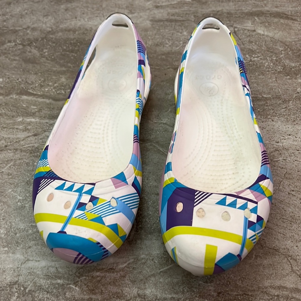 Crocs slip in’s with colorful geometric design and cut outs.